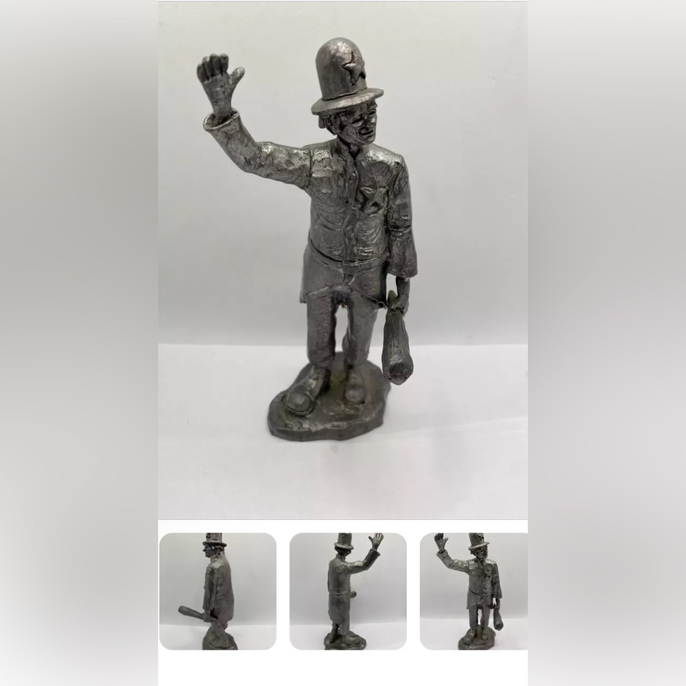 Silver Sculpture Art with Textured Surface and Formal Pose